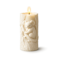 Candle with a carved koala design on a white background