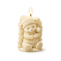 Candle shaped like a bear in winter clothing on a white background
