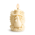 Decorative candle with a rooster design on a white background