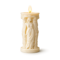 Decorative candle with a figurine design on a white background