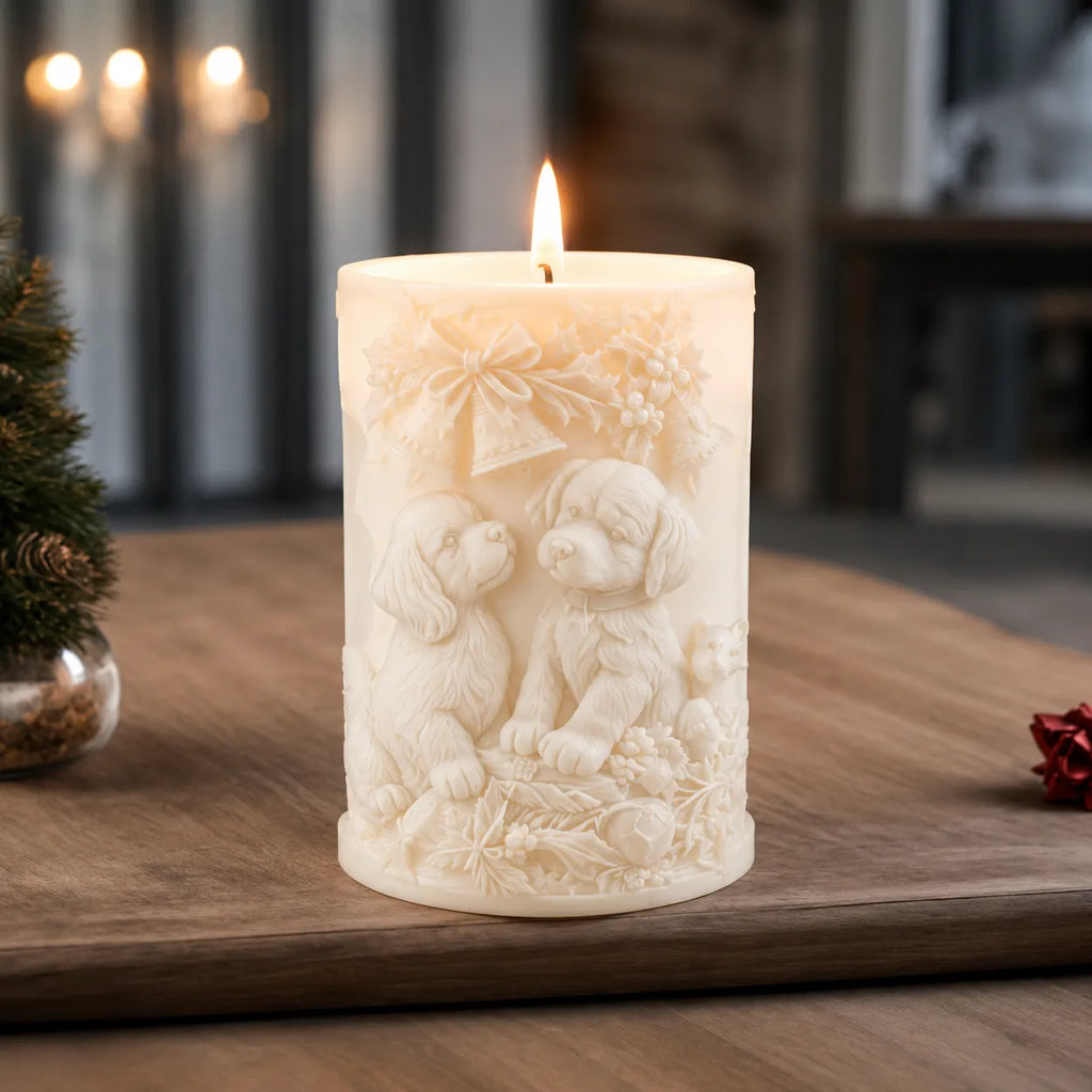 Decorative candle with dog designs on a wooden surface