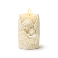 Decorative candle with angel and child design on a white background