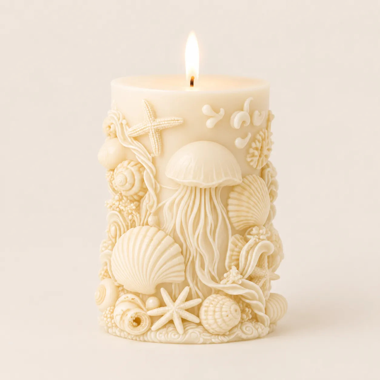 Decorative candle with marine-themed design on a plain background