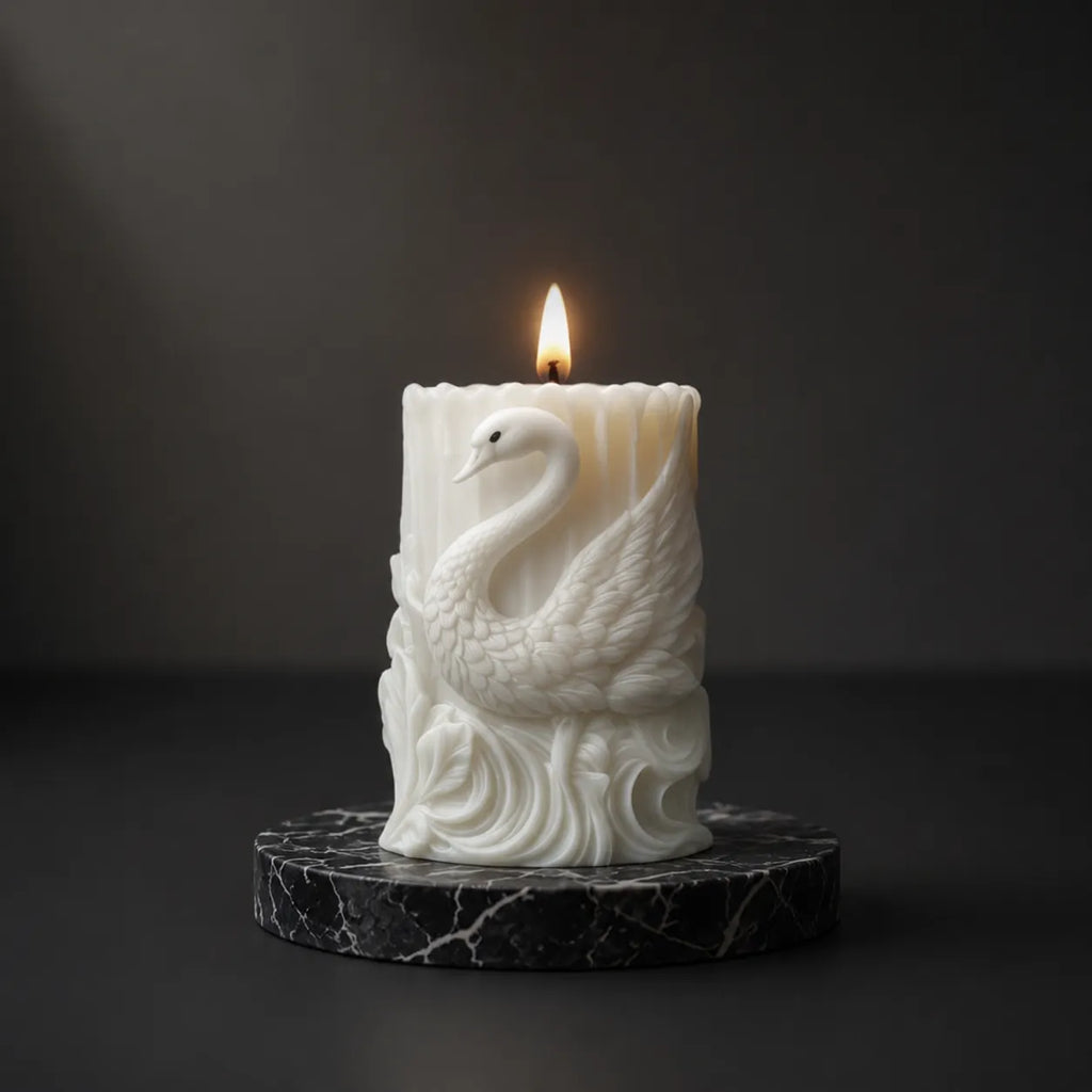 Candle with a swan design on a dark background