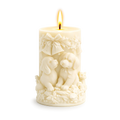 Decorative candle with dog designs on a white background