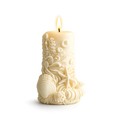 Decorative candle with intricate designs on a white background