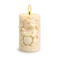 Decorative candle with a bear design on a white background