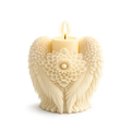 Decorative candle with angel wings and floral design on a white background