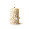Decorative candle with intricate patterns on a white background