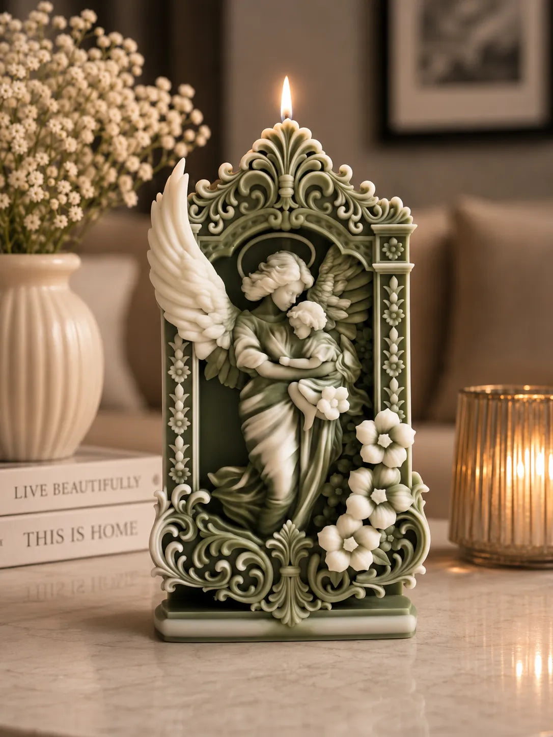 Decorative angel candle with intricate design on a table.